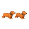 Salero y pimentero en forma de perritos salchicha