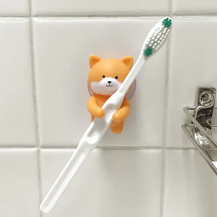 Soporte para cepillo de dientes en forma de conejito o perrito