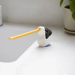 Soporte para estropajo y bayeta con forma de pelícano