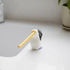 Soporte para estropajo y bayeta con forma de pelícano