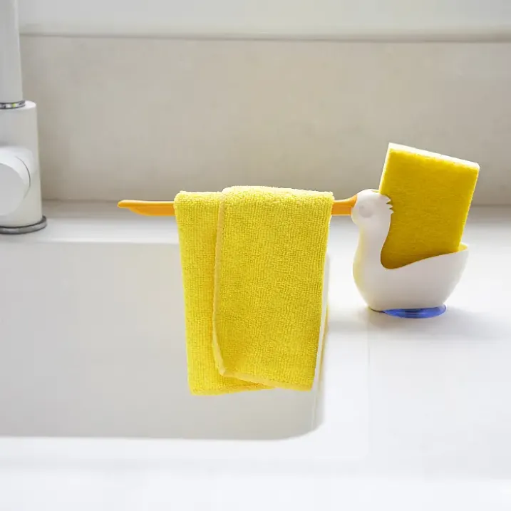 Soporte para estropajo y bayeta con forma de pelícano