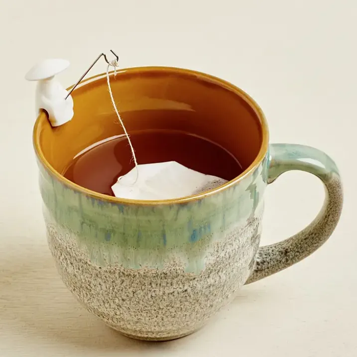 Soportes para bolsitas de té con forma de pescadores chinos