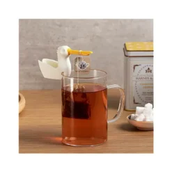 Soporte y colgador de bolsitas de té en forma de pelícano
