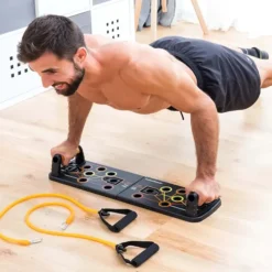 Tabla de flexiones push-up con bandas de resistencia